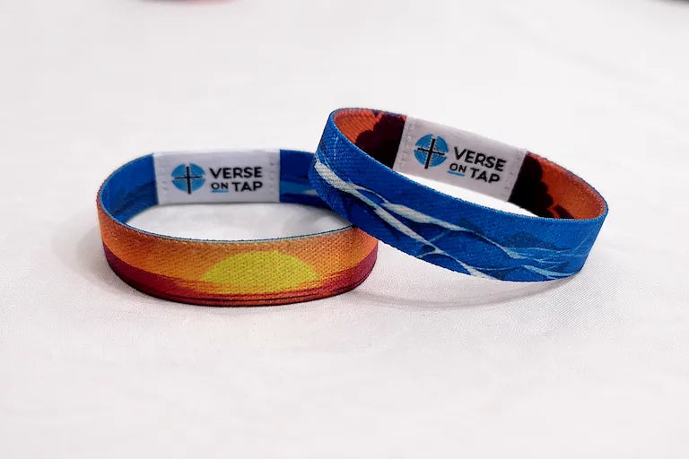 Reversible bracelet. Peace Be Still NFC elastic wristband showing a calming sunset design on one side and the other has a blue stormy ocean pattern inspired by Mark 4:39.