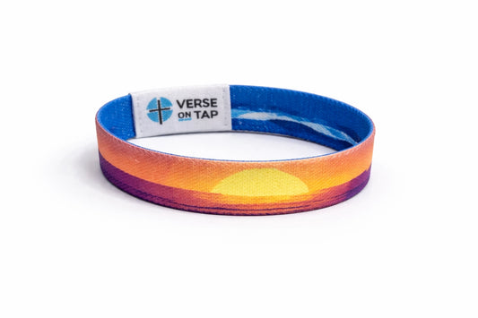 Colorful wristband with a sunset design and 'Verse on Tap' label on a white background