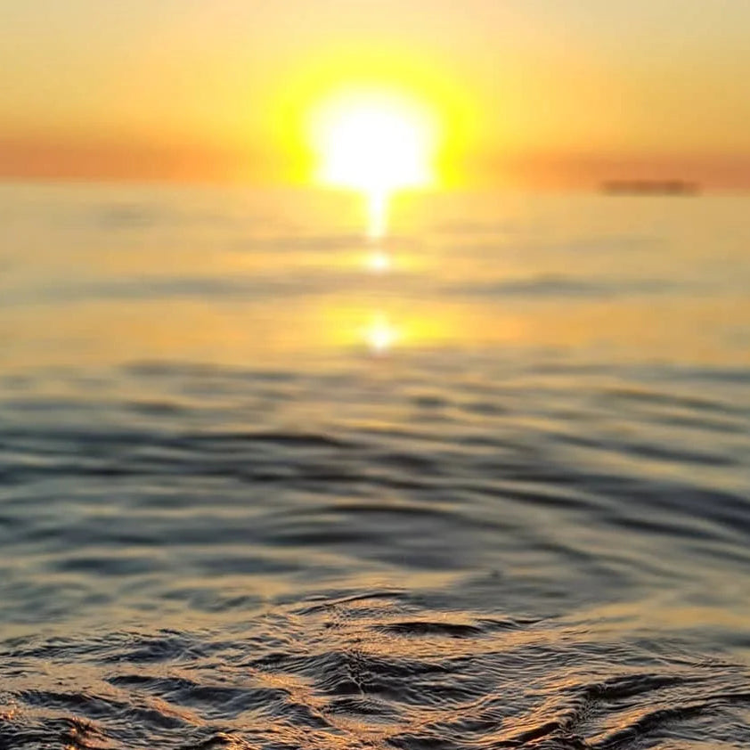 Sunset over water with warm colors