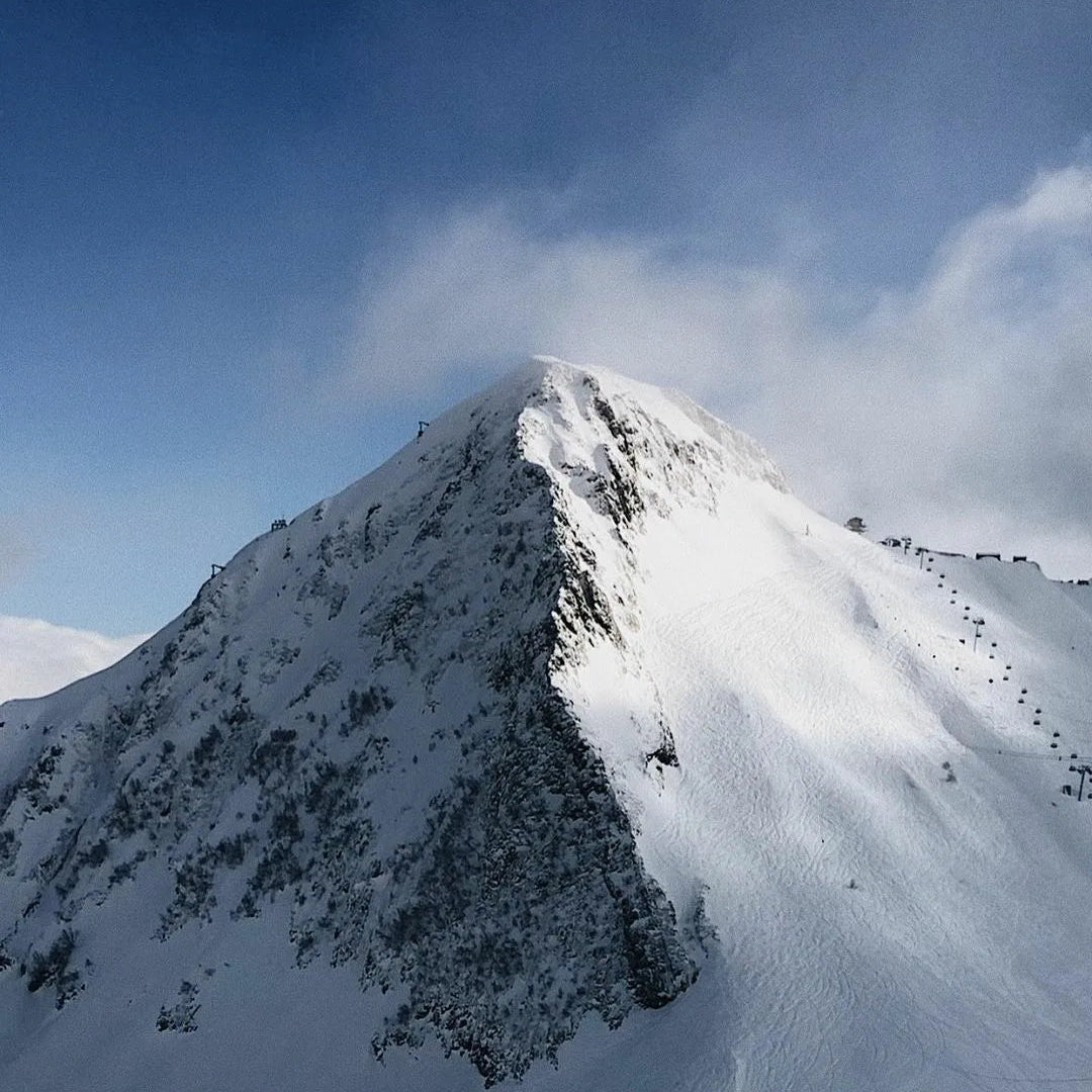 Snow-covered mountain peak with a clear blue sky